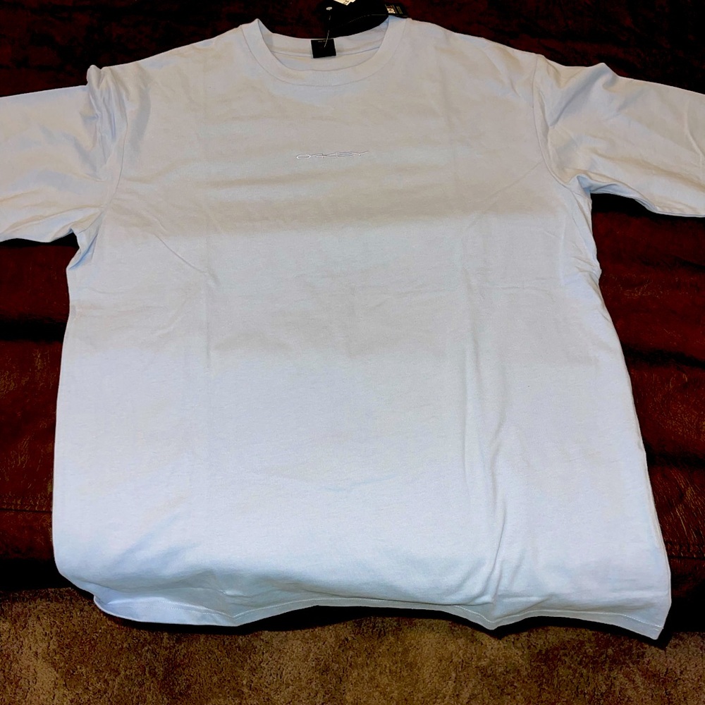 light blue oakley tshirt NWT